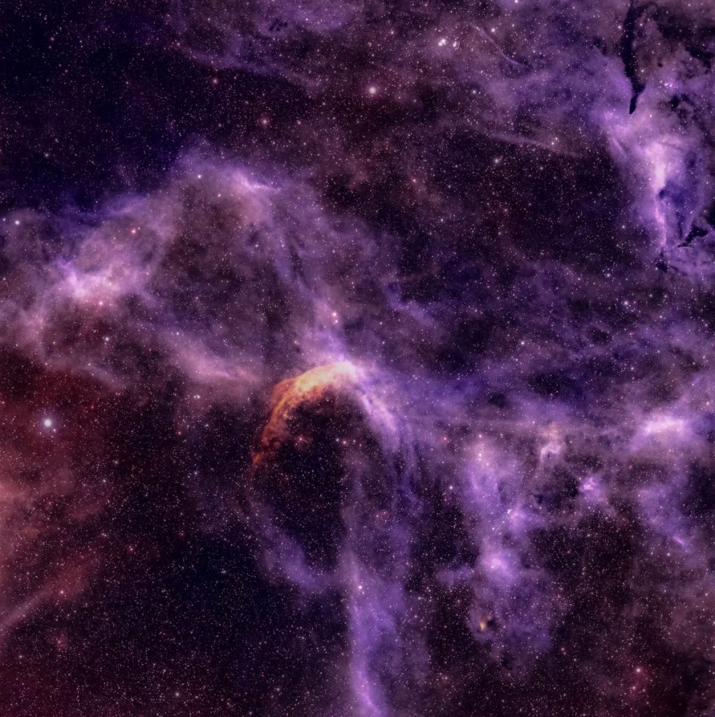 Explore the vibrant colors of cosmic nebulae and star clusters in this stunning astrophotography image.