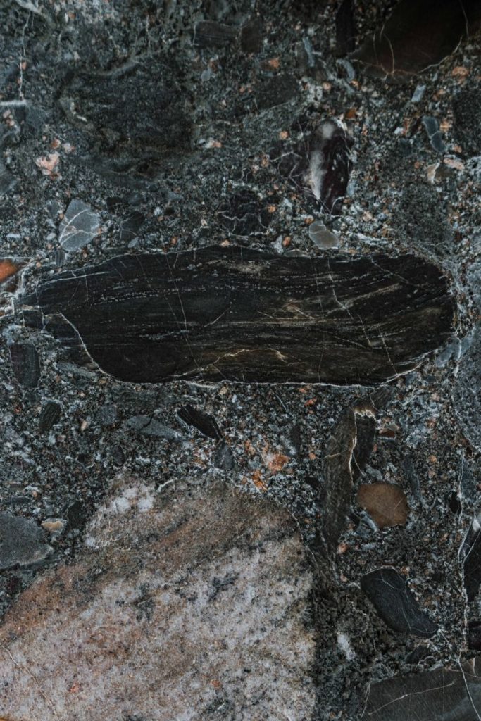 High-detail close-up of dark marble texture showcasing natural patterns.