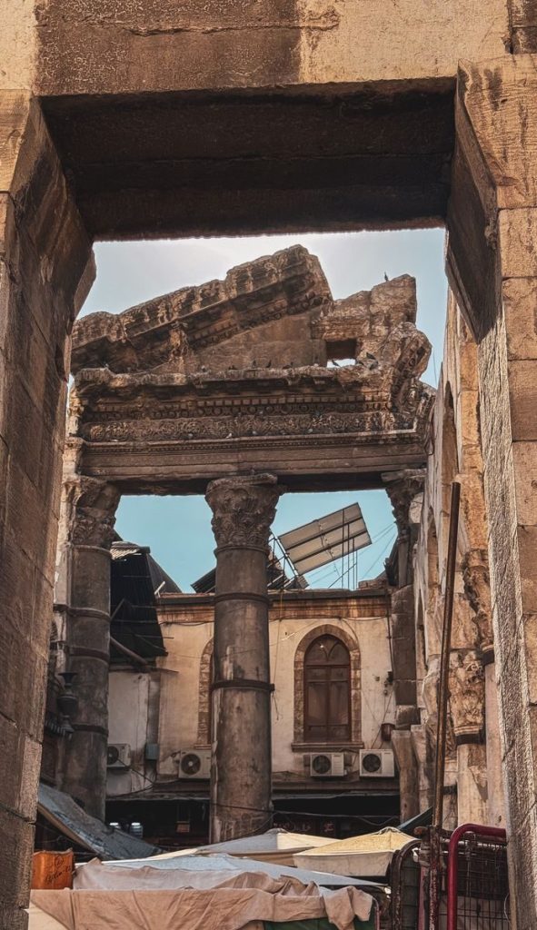 Explore the historical beauty of ancient Roman ruins with detailed stone carvings and towering columns.