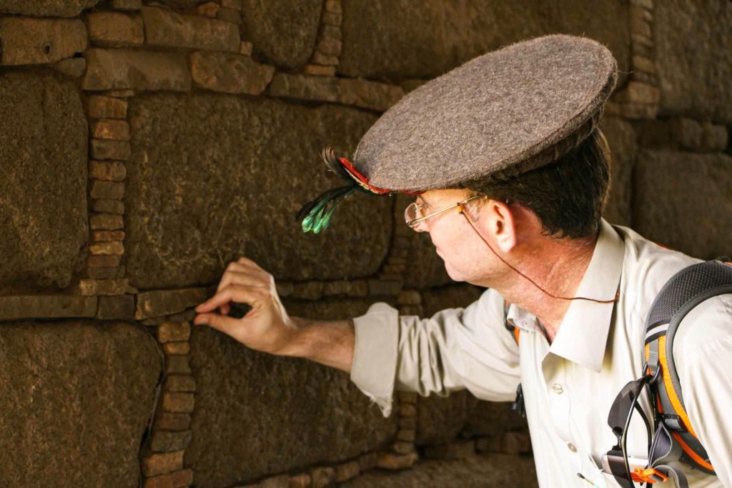 A man examines ancient stone ruins at Rani Ghat, Khyber Pakhtunkhwa, Pakistan.