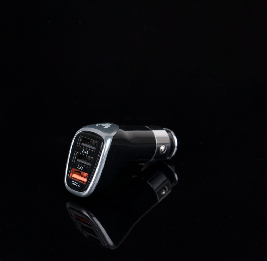 Sleek black car charger featuring multiple USB ports for versatile device charging.