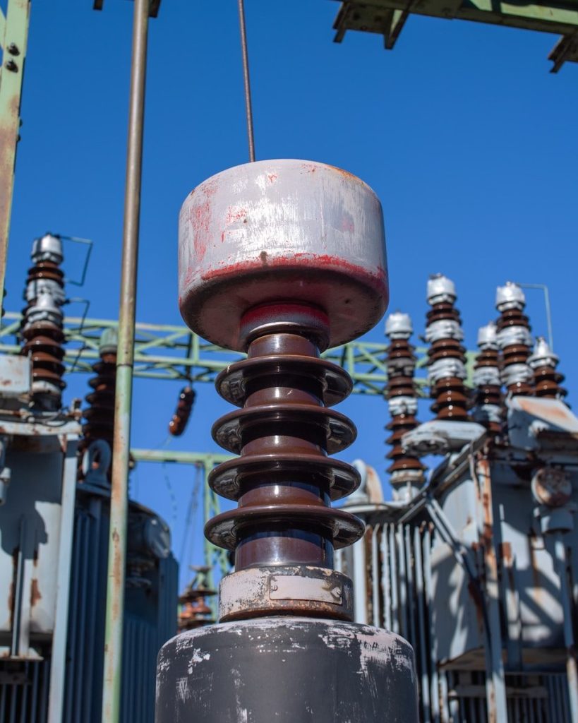 Close-up of electrical insulators at a substation.