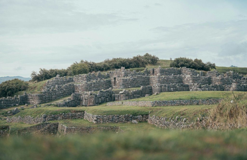 Ancient stone ruins on a grassy hillside