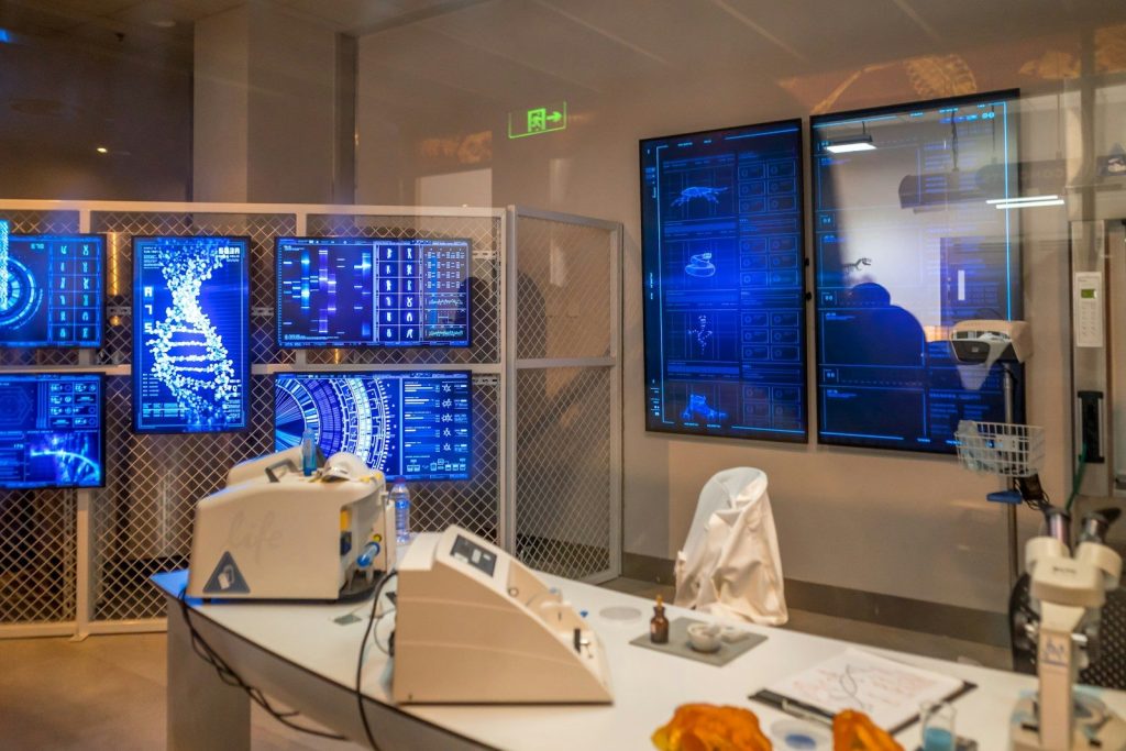 a room with a lot of monitors on the wall