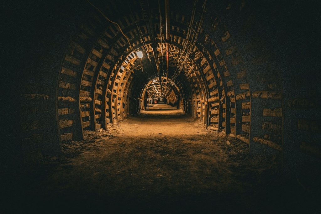 A dark tunnel with a light at the end