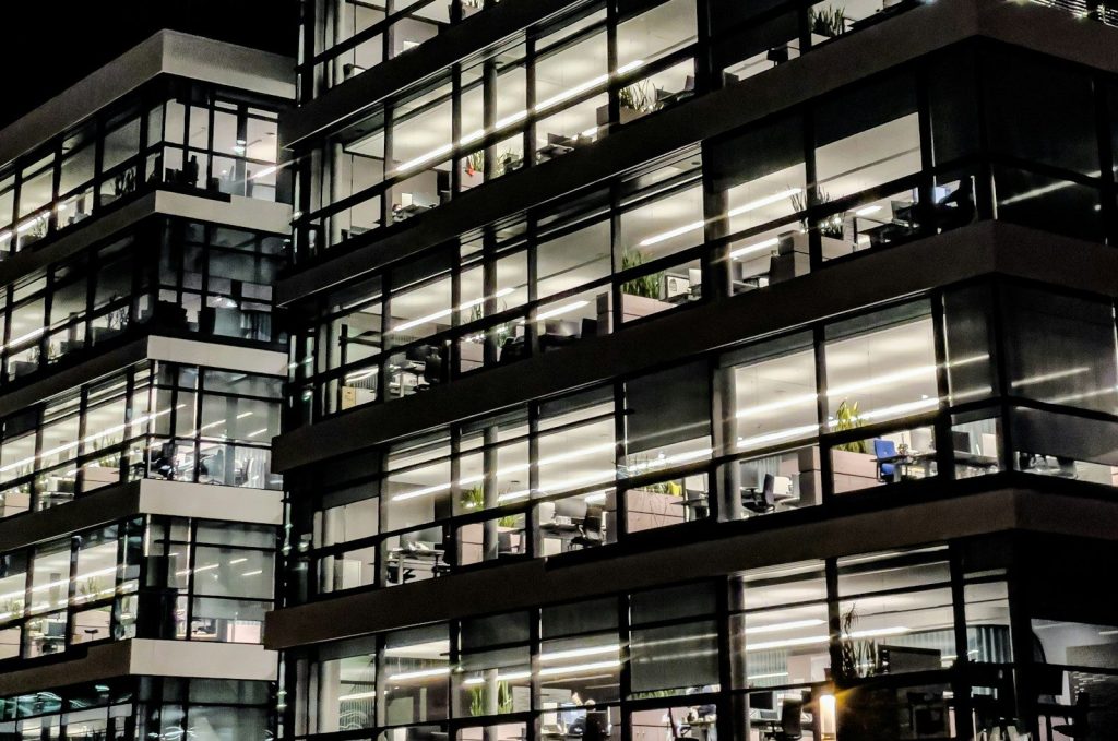 Modern office buildings illuminated at night