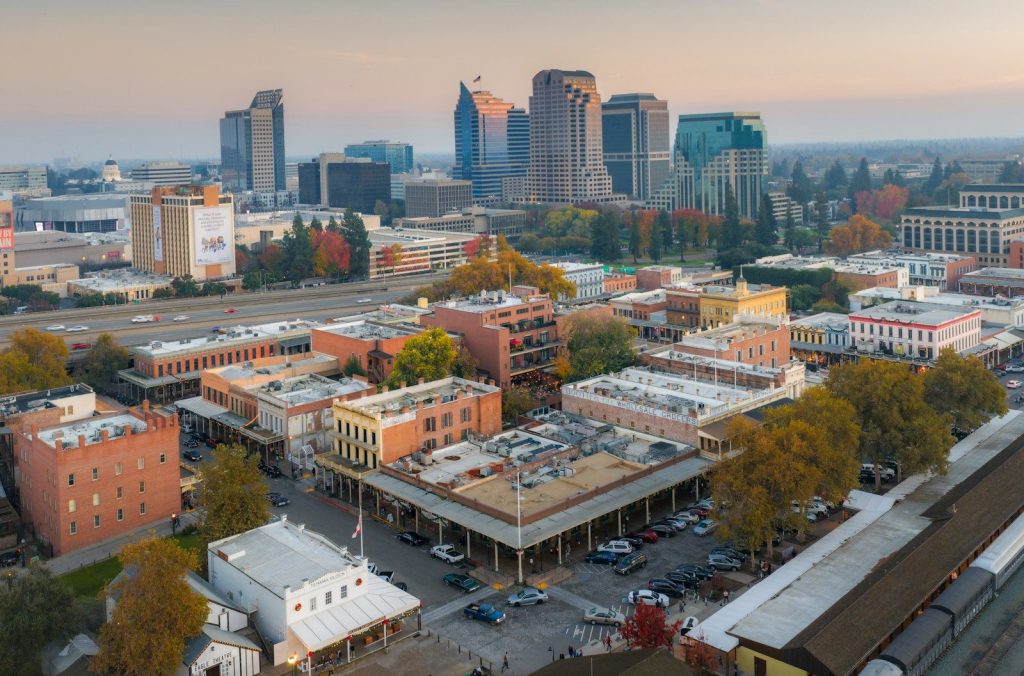 Aerial view of a city skyline with historic buildings.