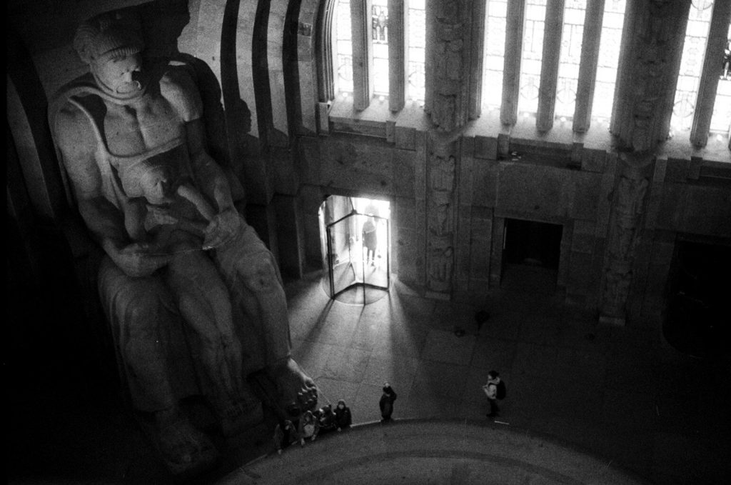 Statue and architectural interior in black and white.